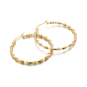Minimalist golden stainless steel bamboo hoop earrings shown in a professional still life view