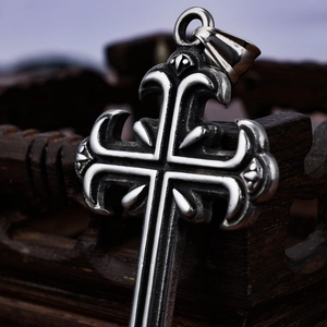 Vintage gothic carved cross pendant in oxidized stainless steel with intricate metal textures