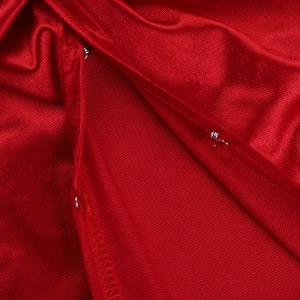 Detail of red knitted fabric texture with a silver metal hook clasp and fine stitching