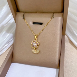 Elegant gold titanium necklace featuring a pink zircon flower pendant with leaf accents