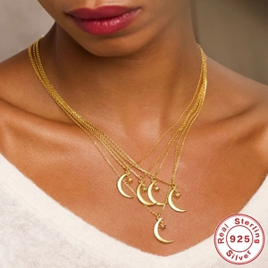 S925 sterling silver gold plated multilayer moon and star necklace on female model