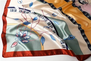 Close-up of calla lily floral satin square scarf showing silk texture and vibrant colors