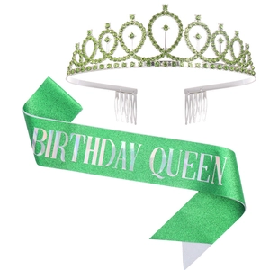 Close-up of green rhinestone crown and sequin sash with Birthday Queen silver text