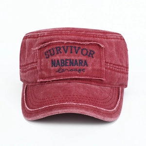 Vintage washed red military flat-top cap featuring an embroidered survivor patch.