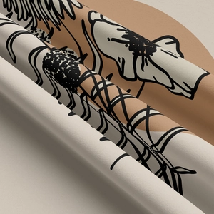 Close-up of bohemian woven tapestry fabric showing abstract floral lines and texture