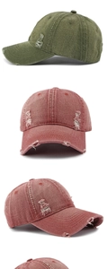 Detailed view of vintage washed denim baseball caps with distressed holes and frayed edges