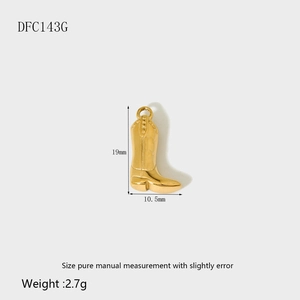 Macro view of gold cowboy boot pendant with 19mm height and 10.5mm base width