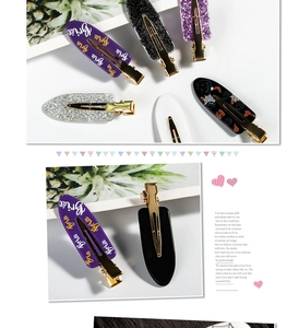 Detail of colorful resin glitter hair clips with metallic grips and Bride text