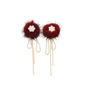 Elegant red pompom earrings with pearl flower and golden beaded fringe on white background