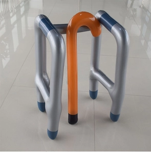 Close-up of inflatable walker and cane set made of shiny PVC material for costume props