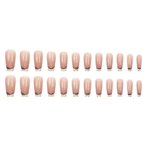 French press-on nails with nude base, white tips, black dots and bow tie designs