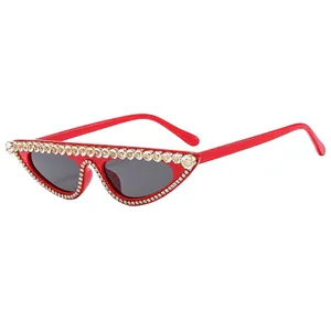 Fashionable red cat-eye sunglasses for women with luxury rhinestone inlaid frame and dark lenses