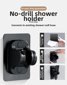 Detail of black adhesive shower head bracket showing adjustable angle and mount