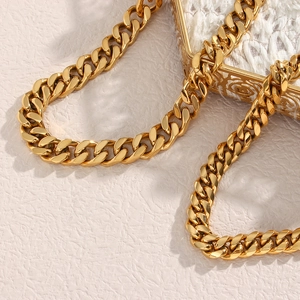 Elegant gold Cuban link chain necklace with heavy metal texture and glossy finish
