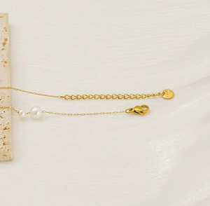 Detail of S925 sterling silver lobster clasp and extension chain on pearl necklace