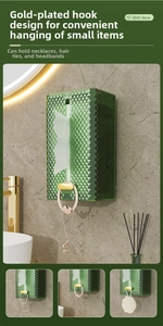 Detail of green diamond-textured wall tissue box with gold hooks for hanging accessories