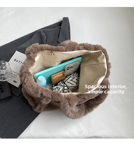 Detailed interior of plush tote bag showing spacious capacity and magnetic closure