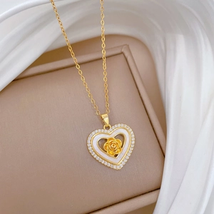 Luxurious gold heart necklace with rose flower, shell inlay, and sparkling crystals