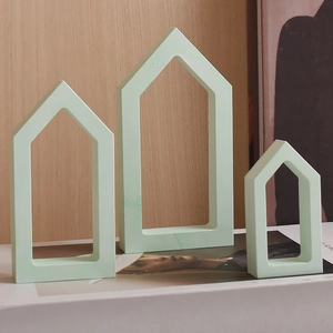 Three mint green hollow house silicone molds in small, medium, and large sizes