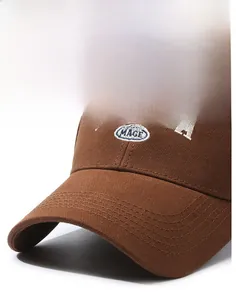 Macro detail of brown cotton baseball cap with white embroidery and reinforced stitching