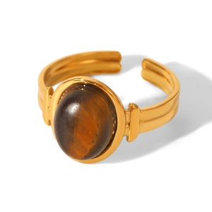 Macro detail of 18K gold plated stainless steel ring with natural tiger eye gemstone