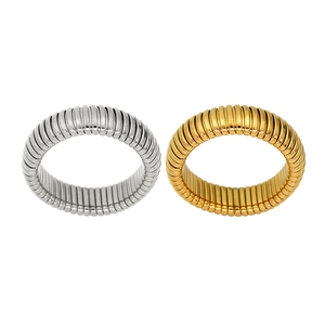 Minimalist 6mm snake stretch ring in polished gold and silver industrial ribbed style