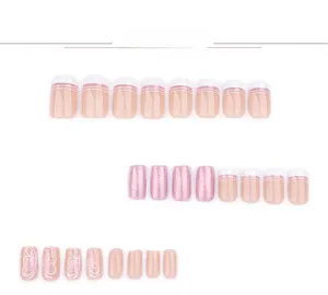 Detail of pink glitter press-on nails with white butterfly patterns and french stripes