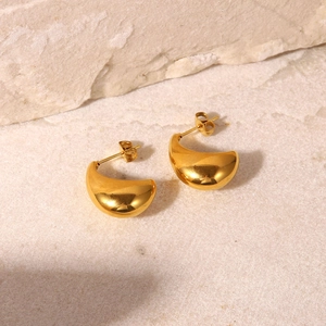 Polished 18K gold plated teardrop stud earrings on white natural stone background
