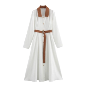 Detail view of white corduroy dress with brown lapels, gold buttons and matching waist belt