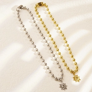 Collane vintage con ciondolo a sole in oro e argento con catena a sfere lucide