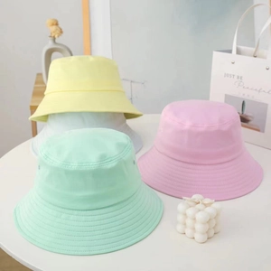 Minimalist wide brim cotton bucket hats in yellow white green and pink for sun protection