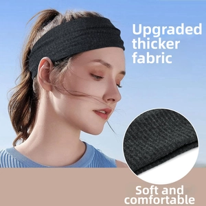 Close-up of black ribbed sports headband showing the soft upgraded thicker fabric detail