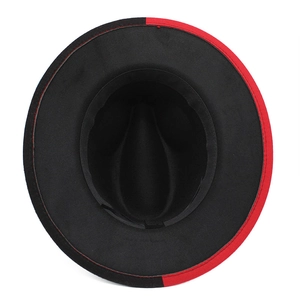 Detailed view of the red and black bicolor wool fedora hat with smooth felt texture