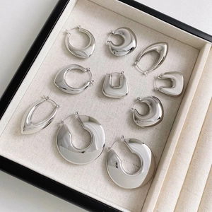 Minimalist stainless steel hollow hoop earrings collection in various geometric shapes