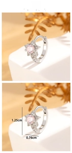 Detail view of star-shaped silver earring with pink zircon, size 1.25cm by 0.76cm