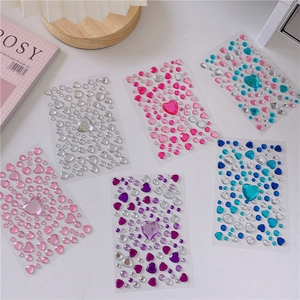 Detailed view of six colorful acrylic heart gem stickers for DIY girls crafts