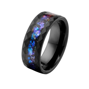 Close-up of a black faceted titanium steel ring with vibrant purple and blue inlay