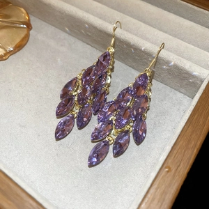 Detail of purple marquise crystal leaf drop earrings with elegant golden hooks
