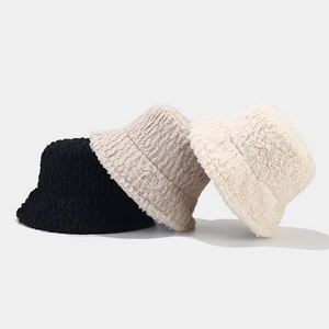 Solid color plush bucket hats in black, taupe and beige for winter warmth and style