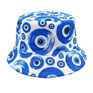 Close-up of printed Nazar evil eye pattern on canvas bucket hat showing fabric texture