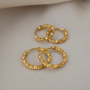 Textured gold twist hoop earrings in stainless steel with elegant multifaceted finish