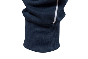 Detailed macro view of navy blue ribbed cuffs featuring a white contrasting stripe accent