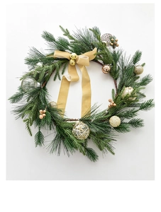 Close-up of Nordic 50cm Christmas wreath with gold bells, velvet bows and festive ornaments