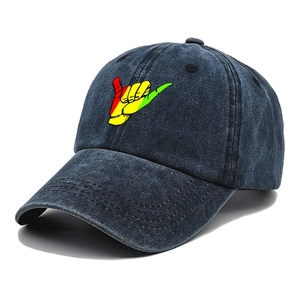 Vintage navy blue washed denim baseball cap featuring a colorful shaka hand gesture embroidery