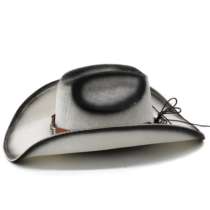 Detail of woven cowboy hat featuring black gradient edges and brown leather band