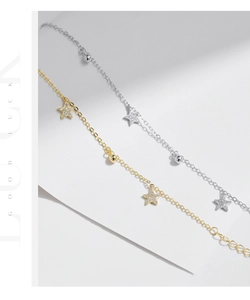 Close-up of S925 sterling silver star pendants with pavé zircons on delicate chains