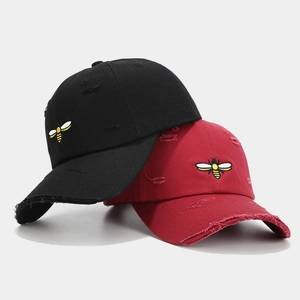 Distressed baseball cap with bee embroidery in black and burgundy canvas fabric