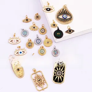 Macro detail of various Evil Eye lucky charm pendants with enamel and cubic zirconia