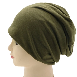 Side view of dark olive green knit slouchy beanie cap on a mannequin head
