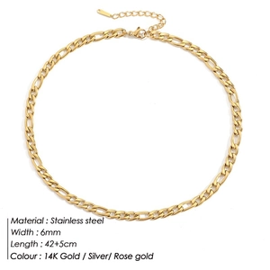 Macro detail of 6mm gold Figaro chain necklace featuring stainless steel links and lobster clasp